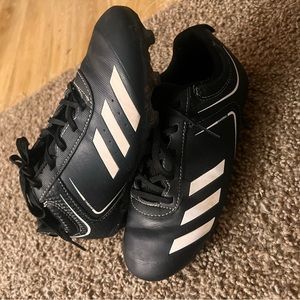 Boy’s Adidas cleats.